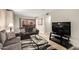 Inviting living room featuring neutral tones, comfortable seating, and sliding glass door to the patio at 4303 E Cactus Rd # 408, Phoenix, AZ 85032