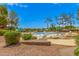 Inviting community pool with lounge chairs, greenery, and scenic views at 4303 E Cactus Rd # 408, Phoenix, AZ 85032