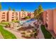 Aerial view of landscaped community pool, perfect for residents seeking relaxation and recreation at 4303 E Cactus Rd # 408, Phoenix, AZ 85032