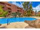 This beautiful community pool has tranquil waterfalls and is surrounded by lush greenery, a perfect retreat at 4303 E Cactus Rd # 408, Phoenix, AZ 85032