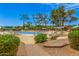 Relaxing community pool with lounge chairs, umbrellas, and manicured landscaping at 4303 E Cactus Rd # 408, Phoenix, AZ 85032