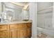 Bright bathroom features wood cabinets, granite counters, and a shower/tub combo at 4850 E Desert Cove Ave # 251, Scottsdale, AZ 85254