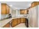 Kitchen with stainless steel appliances, granite countertops, and light wood cabinets at 4850 E Desert Cove Ave # 251, Scottsdale, AZ 85254
