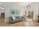 Open living room with a comfortable couch and sliding glass door access to a patio at 4850 E Desert Cove Ave # 251, Scottsdale, AZ 85254