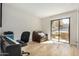 Bright living room with wood floors and sliding glass door to outdoor patio at 4850 E Desert Cove Ave # 251, Scottsdale, AZ 85254