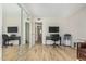 Spacious living room with mirrored closet and an attached bathroom at 4850 E Desert Cove Ave # 251, Scottsdale, AZ 85254