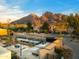 Expansive backyard featuring modern outdoor seating, serene water features, and mountain views at 4900 E Arroyo Verde Dr, Paradise Valley, AZ 85253