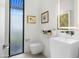 Contemporary bathroom features a floating sink, modern fixtures, and natural light from a window at 4900 E Arroyo Verde Dr, Paradise Valley, AZ 85253