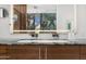 Sleek bathroom featuring double sinks, marble countertop, and a well lit mirror at 4900 E Arroyo Verde Dr, Paradise Valley, AZ 85253