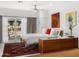 Inviting bedroom with wooden furnishings and an outdoor patio with a chair, bathed in sunlight at 4900 E Arroyo Verde Dr, Paradise Valley, AZ 85253