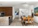 Dining area with a large dining table, kitchen island and artful accents at 4900 E Arroyo Verde Dr, Paradise Valley, AZ 85253