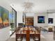 Dining area with a large dining table, fireplace, and views of the outdoors at 4900 E Arroyo Verde Dr, Paradise Valley, AZ 85253