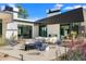Modern home exterior with stylish patio furniture and beautiful landscaping, perfect for enjoying the outdoor living space at 4900 E Arroyo Verde Dr, Paradise Valley, AZ 85253