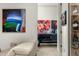 Hallway with modern decor, artwork, and view of a classic car at 4900 E Arroyo Verde Dr, Paradise Valley, AZ 85253