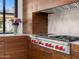 Gourmet kitchen featuring custom wood cabinets, marble countertops, and a high-end range at 4900 E Arroyo Verde Dr, Paradise Valley, AZ 85253