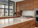 Modern kitchen featuring custom wood cabinets, marble countertops, and high-end appliances at 4900 E Arroyo Verde Dr, Paradise Valley, AZ 85253