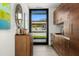 Modern kitchen featuring custom wood cabinets, and views of the outdoors at 4900 E Arroyo Verde Dr, Paradise Valley, AZ 85253