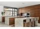 Gourmet kitchen with marble counters, wooden cabinets, and professional-grade stainless steel appliances at 4900 E Arroyo Verde Dr, Paradise Valley, AZ 85253
