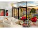 Stylish living room with modern furniture, artwork, and large windows showcasing mountain views and desert landscaping at 4900 E Arroyo Verde Dr, Paradise Valley, AZ 85253