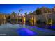 Luxurious pool area with cacti, modern landscape design, and mountain views in the background at 4900 E Arroyo Verde Dr, Paradise Valley, AZ 85253