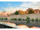 Reflection pool mirroring the sky and surrounding greenery, creating a serene and picturesque outdoor landscape at 4900 E Arroyo Verde Dr, Paradise Valley, AZ 85253