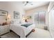 Bright bedroom with large window, carpet, a ceiling fan and two dressers at 5323 E Thunder Hawk E Rd, Cave Creek, AZ 85331