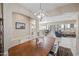Elegant dining room with modern chandelier, neutral paint, and seamless access to the kitchen and living room at 5323 E Thunder Hawk E Rd, Cave Creek, AZ 85331