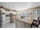 The ample kitchen has eat-in bar seating and abundant natural light with great view outside the windows at 5323 E Thunder Hawk E Rd, Cave Creek, AZ 85331