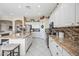 Spacious kitchen featuring granite countertops, white cabinets, and a tiled backsplash at 5323 E Thunder Hawk E Rd, Cave Creek, AZ 85331
