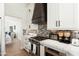 Stylish kitchen with a view into the dining room, complete with stainless steel appliances and a modern design at 5456 E Woodridge Dr, Scottsdale, AZ 85254