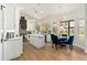 Bright kitchen with white cabinets, stainless steel appliances, an island, and cozy breakfast nook at 5456 E Woodridge Dr, Scottsdale, AZ 85254