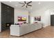 Spacious living room with fireplace, large TV, comfortable sofa, and eye-catching artwork at 5456 E Woodridge Dr, Scottsdale, AZ 85254