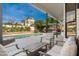 Relaxing outdoor patio with comfortable seating, a pool view, and an outdoor bar, perfect for entertaining at 5456 E Woodridge Dr, Scottsdale, AZ 85254