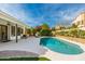 Beautiful backyard pool with well-maintained landscaping and a covered patio, perfect for outdoor relaxation at 5456 E Woodridge Dr, Scottsdale, AZ 85254