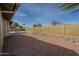 Large backyard with desert rock landscaping and block wall fence at 6010 E Greenway Ln, Scottsdale, AZ 85254