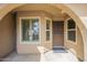 Close-up of the front door with security screen and covered porch at 6010 E Greenway Ln, Scottsdale, AZ 85254