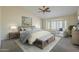 Bedroom features vaulted ceiling, neutral carpet, ceiling fan, and a bay window with shutters at 6010 E Greenway Ln, Scottsdale, AZ 85254