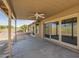Covered patio with ceiling fan and sliding glass doors, ideal for outdoor living at 6010 E Greenway Ln, Scottsdale, AZ 85254