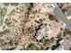 A top-down aerial view of the home surrounded by desert landscape and neighboring houses at 6404 S Lazy Ln, Gold Canyon, AZ 85118