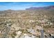 Wide aerial shot showcasing a desert community with homes nestled among the natural landscape at 6404 S Lazy Ln, Gold Canyon, AZ 85118