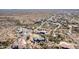Breathtaking aerial view of a desert community and homes interspersed with native vegetation at 6404 S Lazy Ln, Gold Canyon, AZ 85118