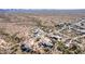 High-altitude aerial showcasing beautiful desert homes, and a mountain backdrop under a clear sky at 6404 S Lazy Ln, Gold Canyon, AZ 85118