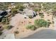 Aerial view of a desert home with a well-manicured yard and desert landscaping at 6404 S Lazy Ln, Gold Canyon, AZ 85118