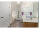 Bathroom features a tub, tile floor, and bright neutral wall paint at 6404 S Lazy Ln, Gold Canyon, AZ 85118