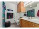 Well-maintained bathroom boasts wooden cabinetry and a bright vanity with plentiful storage at 6404 S Lazy Ln, Gold Canyon, AZ 85118