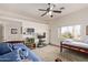 Spacious bedroom features natural light, two beds, aquarium, and tv at 6404 S Lazy Ln, Gold Canyon, AZ 85118