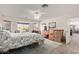 Bright bedroom featuring a ceiling fan, tile flooring, and mountain views at 6404 S Lazy Ln, Gold Canyon, AZ 85118