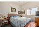 Cozy bedroom with soft natural light, a comfortable bed, and classic decor at 6404 S Lazy Ln, Gold Canyon, AZ 85118