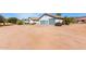 Attractive single-story home featuring desert landscaping and a three-car garage at 6404 S Lazy Ln, Gold Canyon, AZ 85118