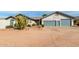 Charming single-story home with a three-car garage and xeriscaped front yard, perfect for desert living at 6404 S Lazy Ln, Gold Canyon, AZ 85118
